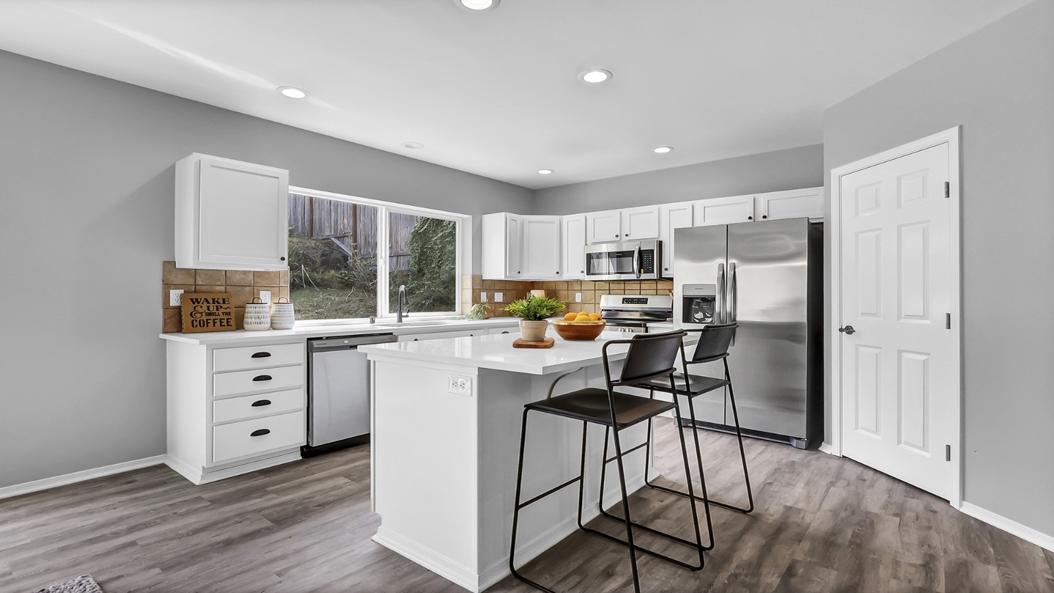 Kitchen after renovation with new flooring